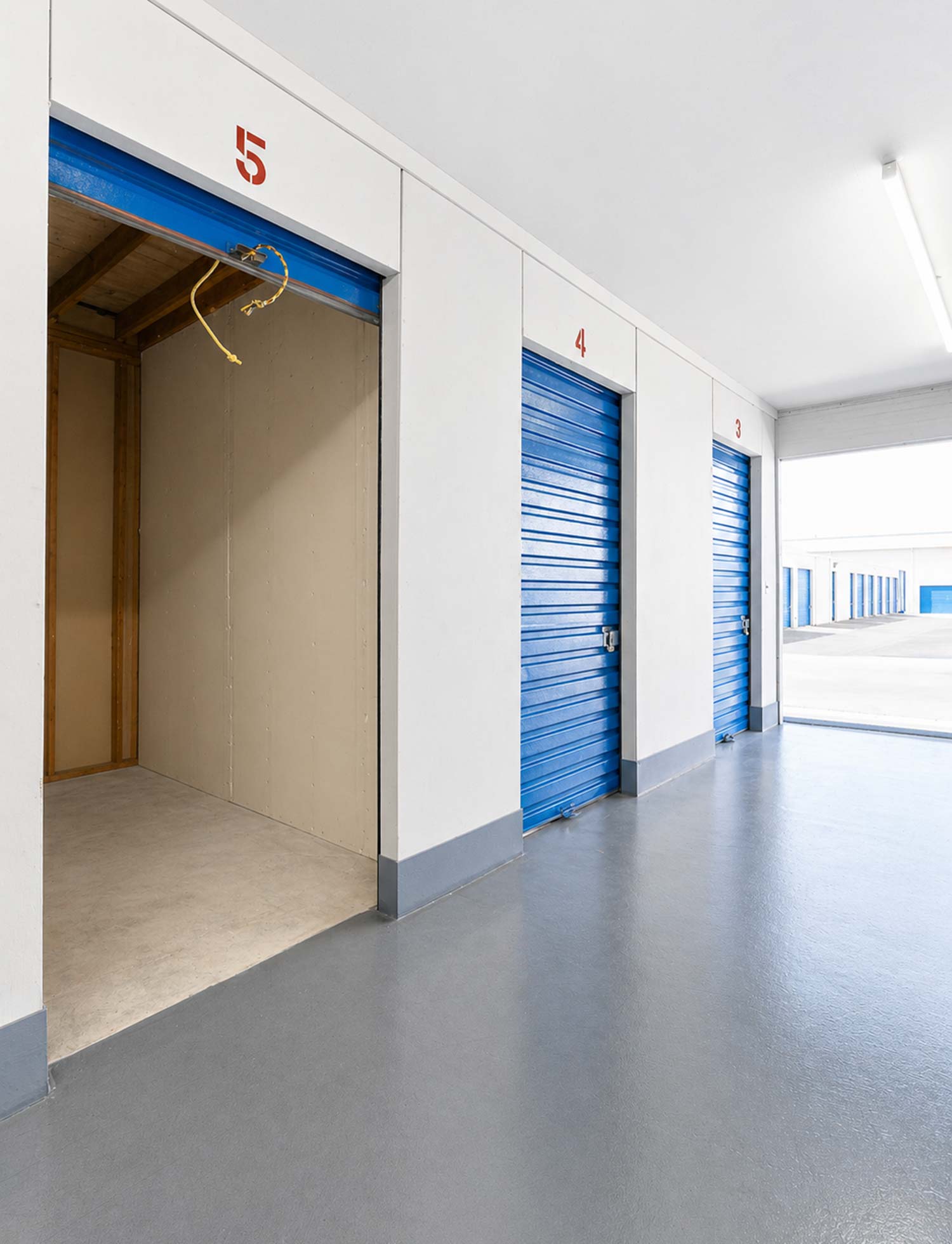 Indoor, clean, bright, and secure storage units.