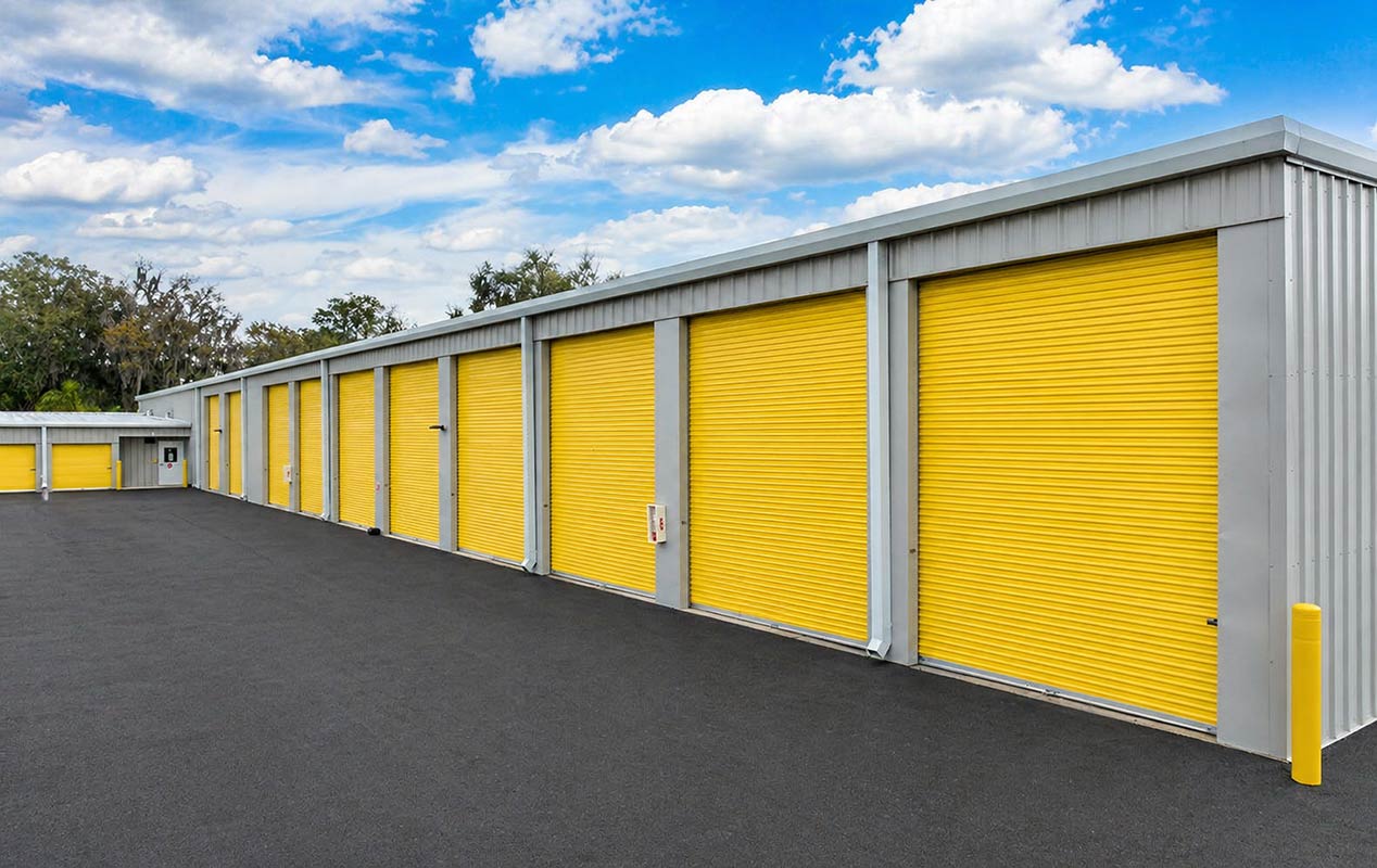 Outdoor drive up units with wide driveway aisles.