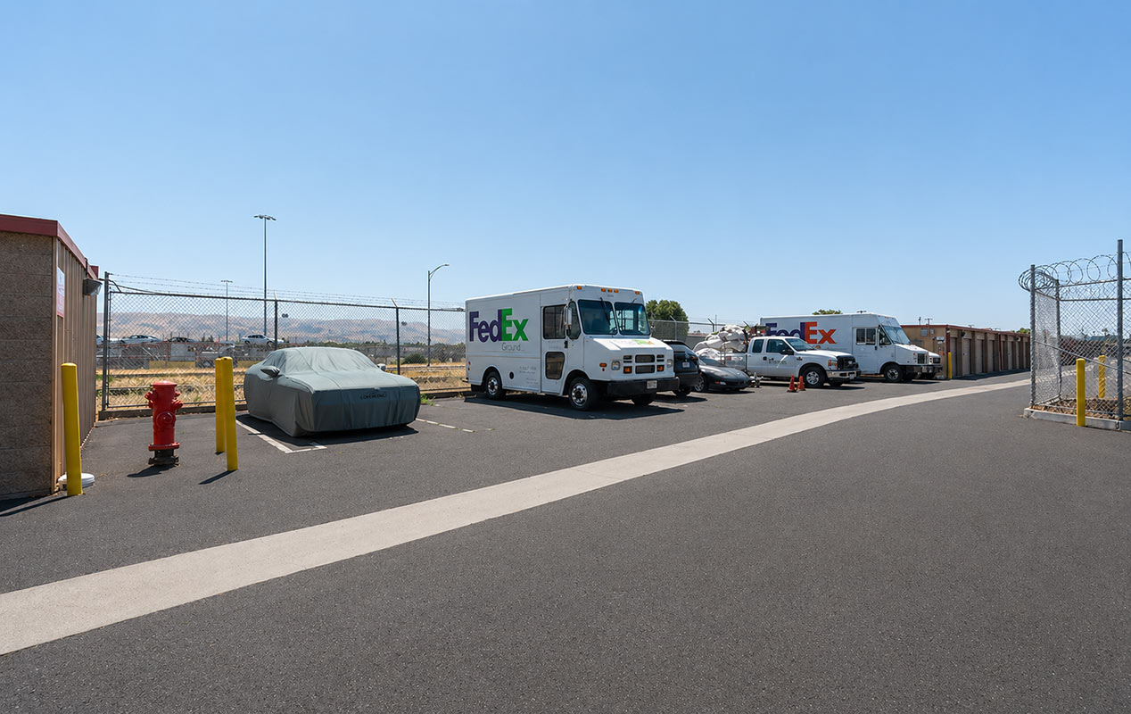 Outdoor parking for vehicles including RVs, boats, and cars.