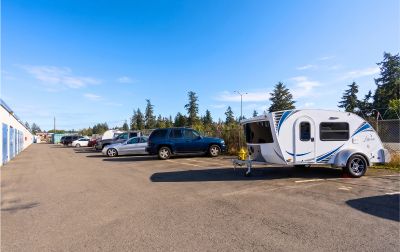 Outdoor parking for vehicles including RVs, boats, and cars.